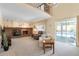 Bright living room with fireplace and access to the outdoor pool at 10520 W 101St Pl, Westminster, CO 80021