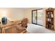 Home office with desk, chair, and view to a carpeted room at 10520 W 101St Pl, Westminster, CO 80021