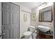 Bathroom with granite countertop vanity, stylish vessel sink, modern fixtures, and ample storage at 11323 Albion St, Thornton, CO 80233