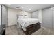Bedroom featuring neutral walls, carpet floors, a spacious closet, and warm, natural lighting at 11323 Albion St, Thornton, CO 80233