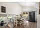 Bright dining room with modern chandelier, table for four, and sliding glass door to the outside patio at 11323 Albion St, Thornton, CO 80233