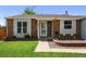 Inviting home featuring a well-maintained lawn, front garden, and attractive facade at 11323 Albion St, Thornton, CO 80233