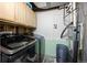 Functional laundry area with modern appliances, upper cabinets, and ample space for sorting at 11323 Albion St, Thornton, CO 80233