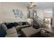 Inviting living room with plush seating, a ceiling fan, and stairs to the second level at 11323 Albion St, Thornton, CO 80233