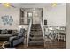 Inviting living room showcasing stairs leading to a second floor at 11323 Albion St, Thornton, CO 80233