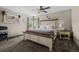 Spacious main bedroom with ceiling fan, carpet flooring, lots of natural light and a queen sized bed at 11323 Albion St, Thornton, CO 80233