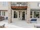 Charming covered patio with stone columns, a built-in grill, and outdoor seating at 10260 Longview Dr, Lone Tree, CO 80124