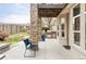 Charming outdoor living space on a covered back porch with mountain views at 10260 Longview Dr, Lone Tree, CO 80124