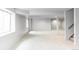 Expansive basement features a new carpet, a window, and a staircase at 10260 Longview Dr, Lone Tree, CO 80124