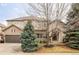 Stunning exterior view of a two-story home, showcasing lush front yard landscaping at 10260 Longview Dr, Lone Tree, CO 80124