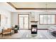 The main bedroom has a fireplace, seating area, large windows, and a comfortable bed with bench seating at 10260 Longview Dr, Lone Tree, CO 80124