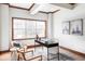 Home office with lots of natural light from a large window and comfortable seating at 10260 Longview Dr, Lone Tree, CO 80124