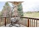 Outdoor patio features comfortable chair and views of the backyard and golf course at 10260 Longview Dr, Lone Tree, CO 80124