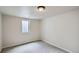 Finished basement room with carpet flooring and a window at 3107 S Wolff St, Denver, CO 80236