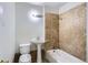 Bathroom with a pedestal sink and shower-tub combo at 3107 S Wolff St, Denver, CO 80236