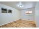 Bedroom with hardwood floors, and two windows letting in plenty of natural light at 3107 S Wolff St, Denver, CO 80236