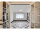 Dining room featuring patterned floors, window and natural light as seen through glass panel doors at 3107 S Wolff St, Denver, CO 80236