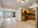Open kitchen and living area featuring stainless steel appliances and hardwood floors at 3107 S Wolff St, Denver, CO 80236