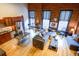 Spacious living room boasting exposed brick, hardwood floors, and large windows providing ample natural light at 1450 Wynkoop St # 3F, Denver, CO 80202