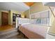 Bedroom with a window view and a walk-in closet, providing natural light and ample storage at 32173 Soda Creek Dr, Evergreen, CO 80439