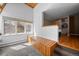 Bright bedroom featuring a built-in storage bench, large windows with natural light, and carpeted flooring at 32173 Soda Creek Dr, Evergreen, CO 80439