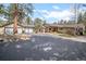 Spacious ranch-style home featuring an attached two-car garage and an oversized detached two-car garage at 32173 Soda Creek Dr, Evergreen, CO 80439
