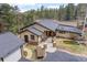 Charming single-story home featuring a beautiful yard with a pond and convenient circular driveway at 32173 Soda Creek Dr, Evergreen, CO 80439