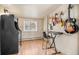 Recreation area features hardwood floors, an arcade station, and a keyboard stand with guitars hanging on the wall at 32173 Soda Creek Dr, Evergreen, CO 80439