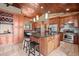 Spacious kitchen with a breakfast nook, hardwood floors, and stainless steel appliances at 32173 Soda Creek Dr, Evergreen, CO 80439