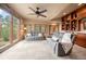 Spacious living room featuring large windows offering scenic outdoor views and plush, comfortable seating at 32173 Soda Creek Dr, Evergreen, CO 80439