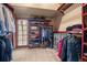 Walk-in closet boasts custom wood shelving and racks, providing ample storage space for an organized wardrobe at 32173 Soda Creek Dr, Evergreen, CO 80439