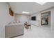 Cozy basement living area featuring a modern sectional, television, and shiplap accent wall at 1080 E 130Th Ave # A, Thornton, CO 80241