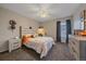 This cozy bedroom offers a ceiling fan, desk and sports themed decorations at 1080 E 130Th Ave # A, Thornton, CO 80241
