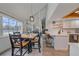 Bright dining area with natural light, table, and kitchen bar at 1080 E 130Th Ave # A, Thornton, CO 80241