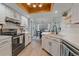 Modern kitchen featuring white cabinets, subway tile backsplash, updated appliances and wood detail at 1080 E 130Th Ave # A, Thornton, CO 80241