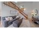 A cozy living room offers natural light and a staircase leading to the second floor at 1080 E 130Th Ave # A, Thornton, CO 80241