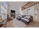 Bright living room boasts vaulted ceilings, fireplace, large windows, and an open floor plan at 1080 E 130Th Ave # A, Thornton, CO 80241