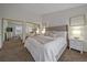Serene main bedroom with neutral tones, plush carpeting, and ample closet space for a relaxing retreat at 1080 E 130Th Ave # A, Thornton, CO 80241