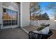 Private patio space includes a sliding glass door, white fence and outdoor seating at 1080 E 130Th Ave # A, Thornton, CO 80241