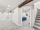 Finished basement hallway with carpeted stairs, recessed lighting, and an open doorway to another room at 3210 Newport St, Denver, CO 80207