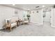 Inviting basement seating area with chairs, decorative items, and a neutral color scheme at 3210 Newport St, Denver, CO 80207