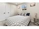 Relaxing bedroom with a cozy bed, stylish side tables, and ample natural light streaming through the windows at 3210 Newport St, Denver, CO 80207