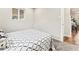 Bright bedroom with soft carpet and a view of the interior, offering comfortable living space at 3210 Newport St, Denver, CO 80207