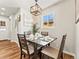 Cozy dining area with a modern light fixture and a window offering natural light at 3210 Newport St, Denver, CO 80207