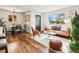 Bright living room with a comfortable seating area, dining space, and a large window for natural light at 3210 Newport St, Denver, CO 80207