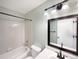 Well-lit bathroom with a bathtub, shower, modern vanity, and decorative mirror at 4901 Yates Ct, Broomfield, CO 80020