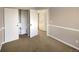 Bedroom featuring closet and access to a hallway at 4901 Yates Ct, Broomfield, CO 80020