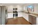 Modern kitchen featuring stainless steel appliances, white cabinets, and granite countertops at 4901 Yates Ct, Broomfield, CO 80020