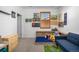 A bedroom featuring a daybed, toys, decor and carpeted floors at 3015 Pershing St, Strasburg, CO 80136