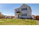 Two-story home with well-kept lawn and tasteful landscaping, blending suburban charm with modern architecture at 3015 Pershing St, Strasburg, CO 80136